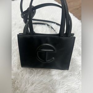 Woman’s mini black Telfar bag